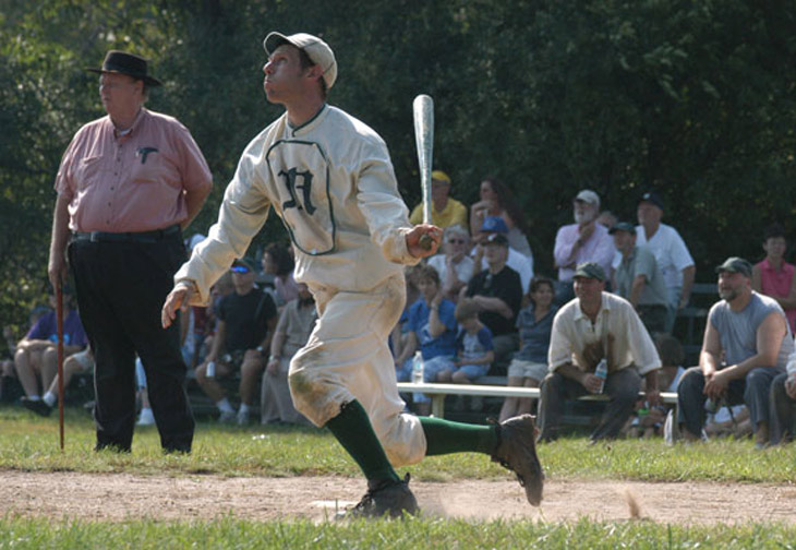 Vintage baseball photo: August 28, 2005 - Woodbury, CT.  Eric “Express” Miklich of the NY Mutuals BBC.  The 21st century NY Mutuals are committed to increasing the public's knowledge of 19th century base ball.  Being hired for community and public events, such as this 1864 match in Woodbury, allows the Mutuals to demonstrate various styles of play in the 19th century and lecture on the history and rules regarding baseballs beginnings. The Umpire shown in the photo is Harry Higham who is the great grandson of Dick Higham, professional baseball player and the NY Mutuals' first captain.  Photo by R.C. Shaw.  Click photo to return to previous page.